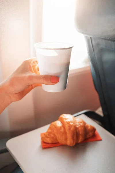 Girl Passenger Eats Croissant Drinks Coffee Sitting Window Airplane Flies — Foto Stock
