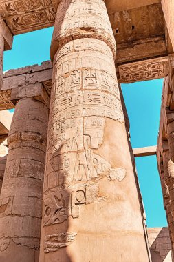 Hypostyle Hall with huge columns in Karnak temple in the famous city of Luxor. Travel attractions and heritage in Egypt