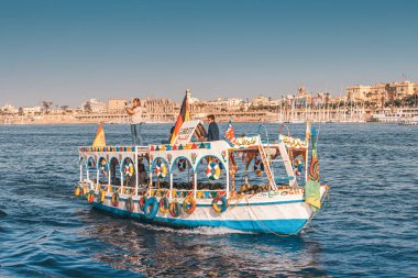 11 January 2022, Luxor, Egypt: Traditional Egyptian ferry motorboats carry passengers from one bank of the Nile to the other