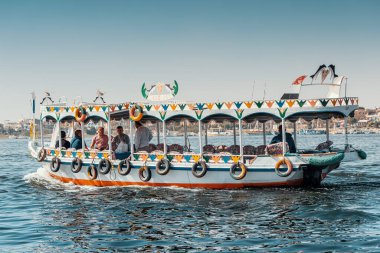 11 January 2022, Luxor, Egypt: Traditional Egyptian ferry motorboats carry passengers from one bank of the Nile to the other