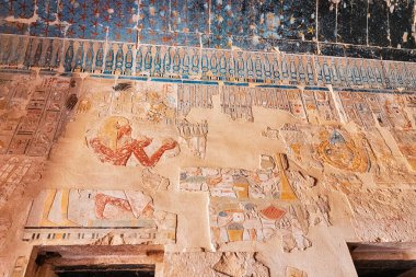 Egyptian wall murals and frescoes and paintings in Hatshepsut temple in Luxor. Religious mysteries and rituals in Egypt mythology and religion