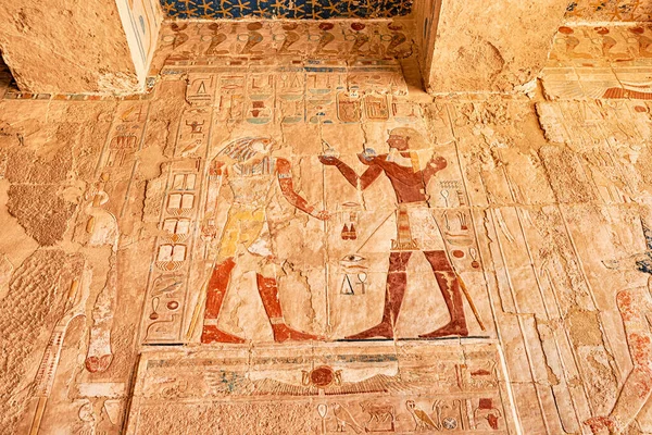 Egyptian wall murals and frescoes and paintings in Hatshepsut temple in Luxor. Religious mysteries and rituals in Egypt mythology and religion