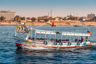 11 January 2022, Luxor, Egypt: Traditional Egyptian ferry motorboats carry passengers from one bank of the Nile to the other