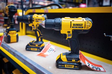 27 June 2022, Antalya, Turkey: DeWALT professional electric screwdriver and other tools and equipment for construction and renovation works for sale in Bauhaus store.