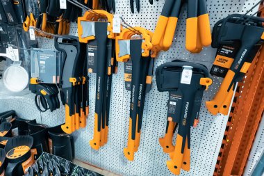 27 June 2022, Antalya, Turkey: Fiskars axes and other tools and equipment in gardening and yardcare shop