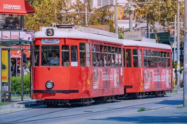 07 July 2022, Antalya, Turkey: Retro vintage tram line for tourists and locals leading to the old town centre.