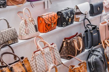07 July 2022, Antalya, Turkey: Learher Bags of Yves Saint Laurent and various world famous fashion brands on the street market. Copyright problems concept