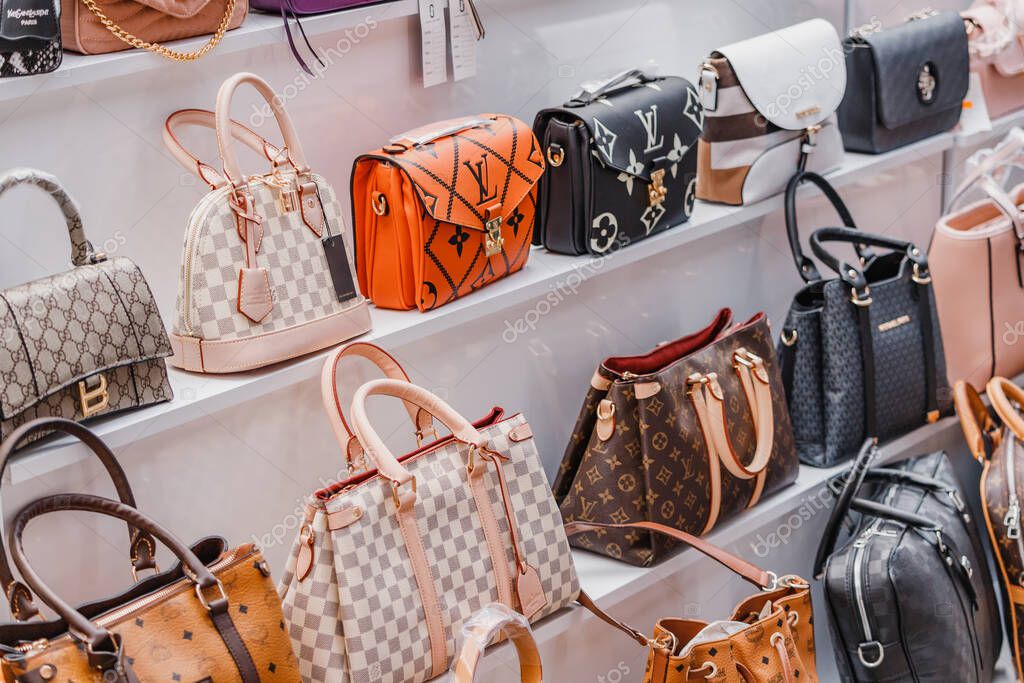 07 July 2022, Antalya, Turkey: Learher Bags of Yves Saint Laurent and various world famous fashion brands on the street market. Copyright problems concept
