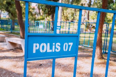 Police fence in city park in Turkish town