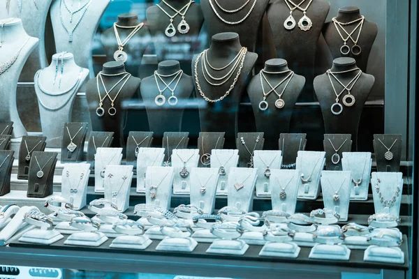 A jewelry store showcase with varioous jewelry, bracelets and rings. The concept of investments and savings
