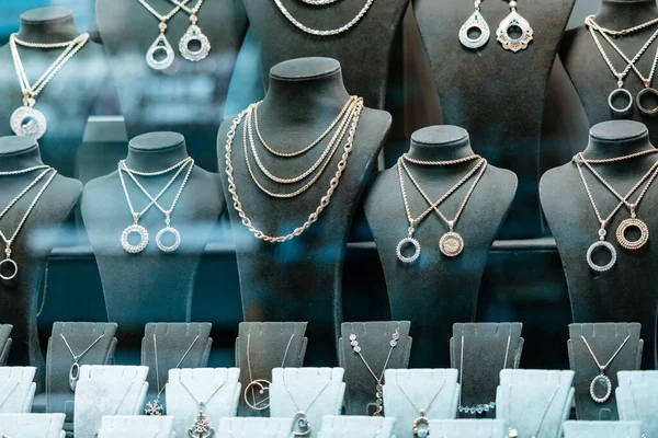 A jewelry store showcase with varioous jewelry, bracelets and rings. The concept of investments and savings