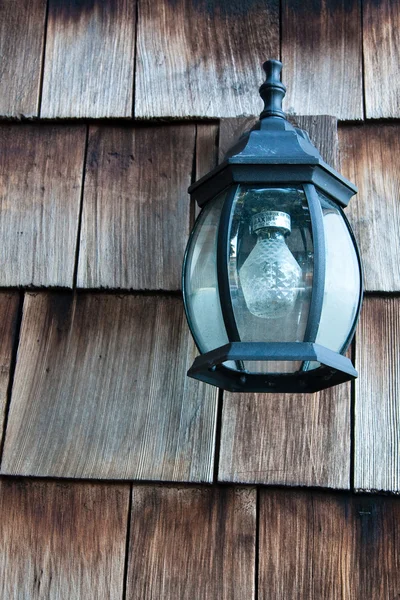 Old Lamp on a Wooden Wall — Stock Photo, Image