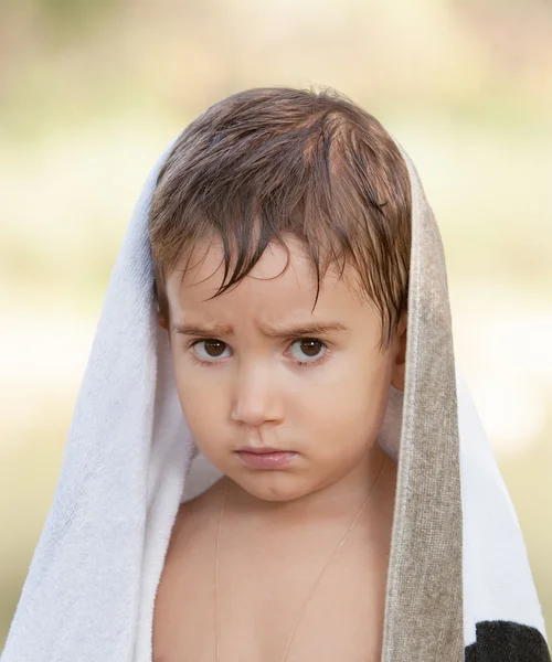 Three year old boy with a serious expression — Stock Photo, Image