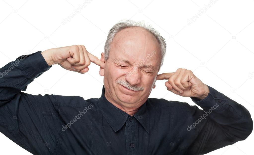 Man covers his ears with his hands