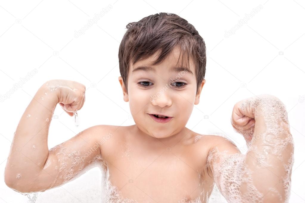 Boy washing in the bathroom