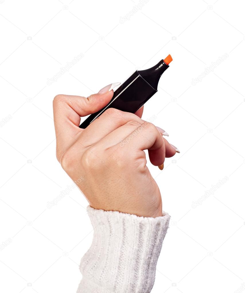 Hand holding a orange marker