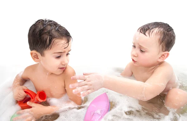 Boys play toys in the bathroom — Stock Photo, Image