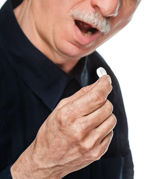 Old man wants to take a pill — Stock Photo, Image