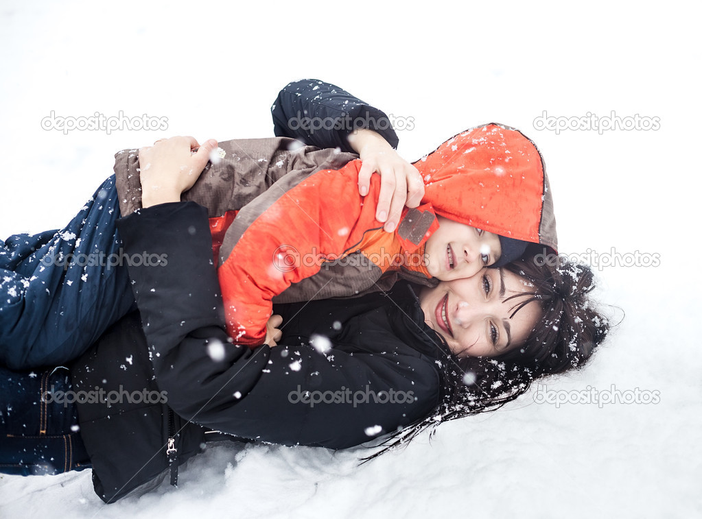 Mother and child playing in snow