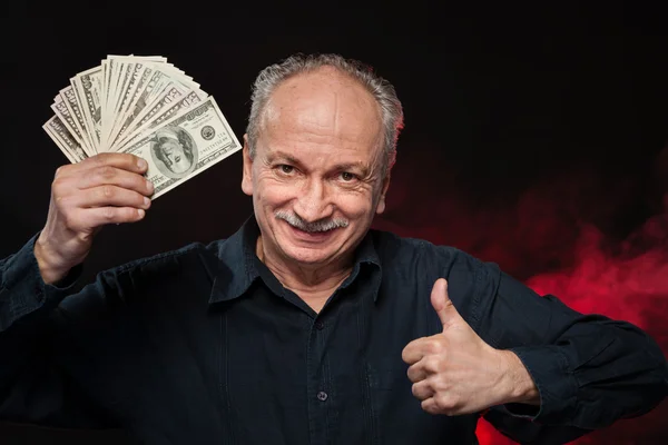 Old man with dollar bills — Stock Photo, Image