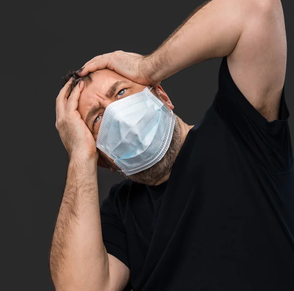 Headache. Man with face closed by hand — Stock Photo, Image
