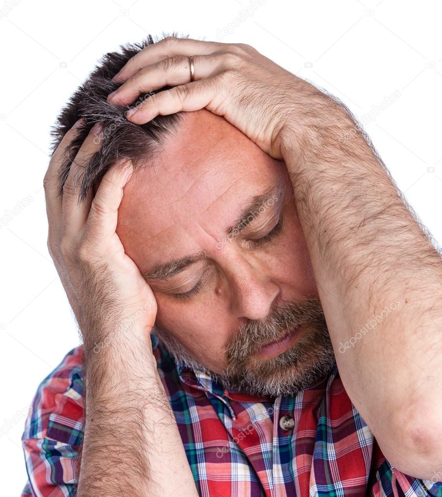Middle age man suffering from a headache