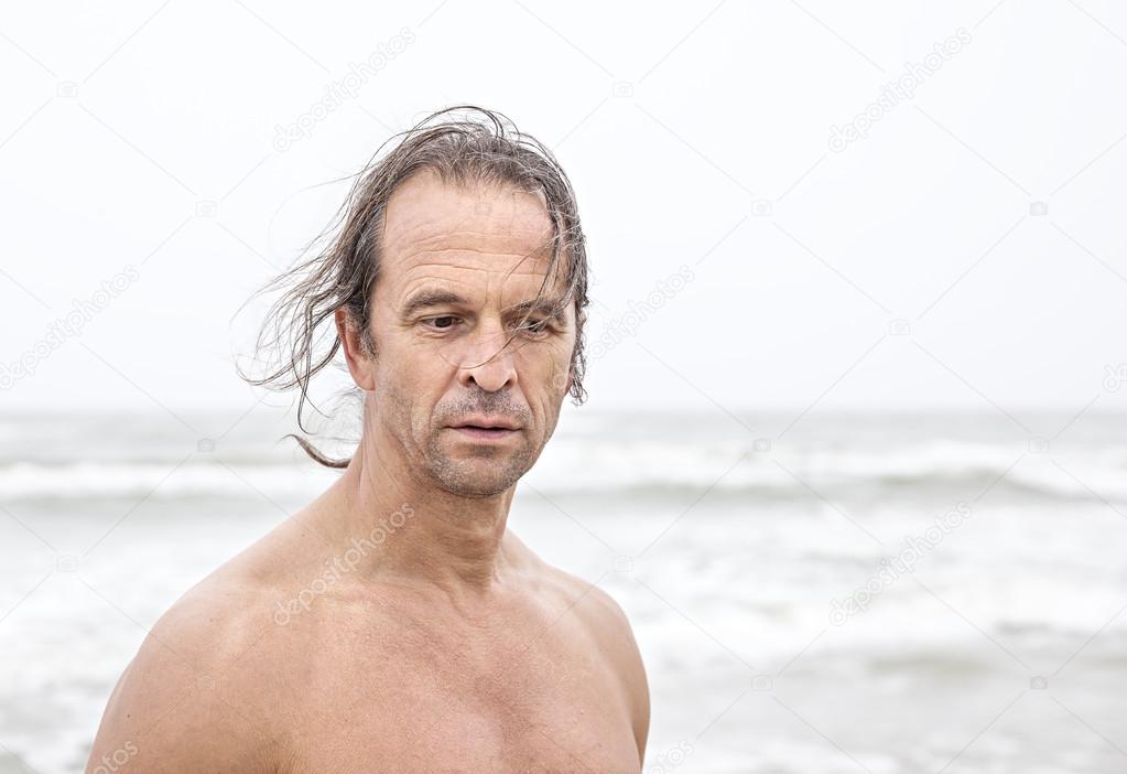 middle-aged man on the beach