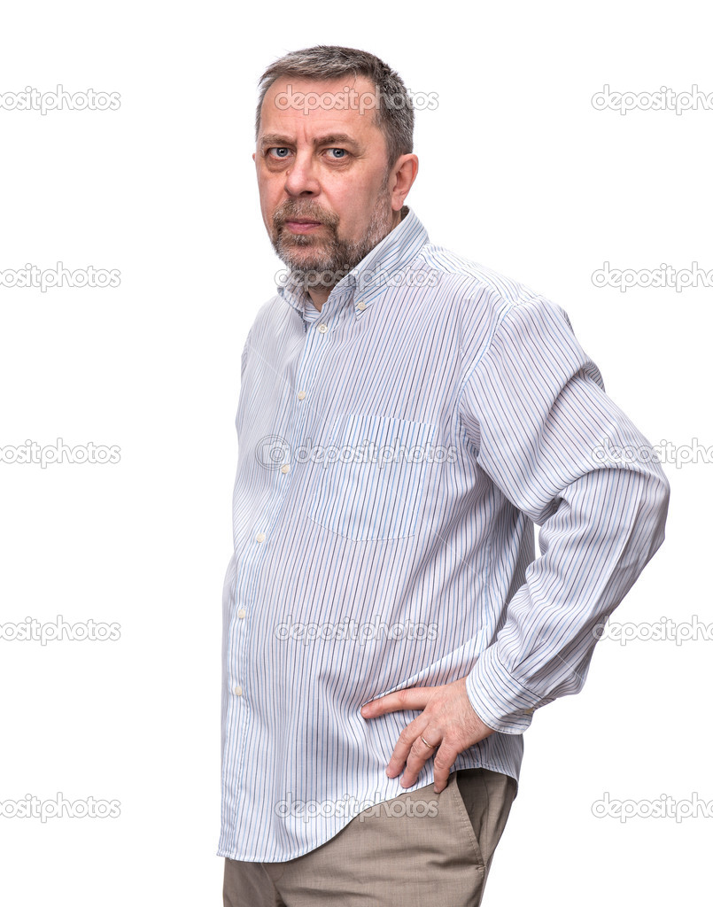 Handsome positive middle-aged business man standing and thinking