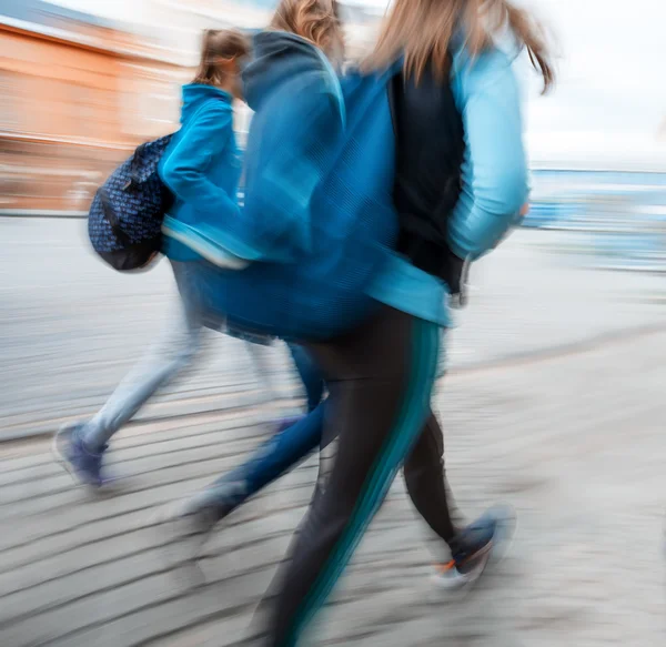 A group of young people going along the street — Stock Photo, Image