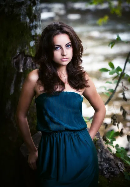 Beautiful woman in the wood near the river — Stock Photo, Image