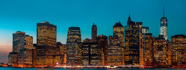 Manhattan at night with lights and reflections. New York City skyline