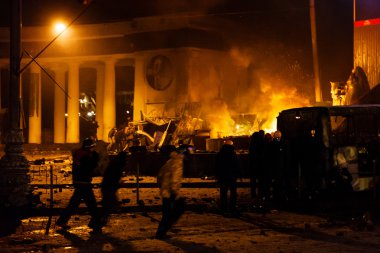 KIEV, UKRAINE - January 20, 2014: Violent confrontation and anti clipart