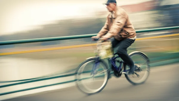 Abstract image of cyclist on the city roadway — Stock Photo, Image
