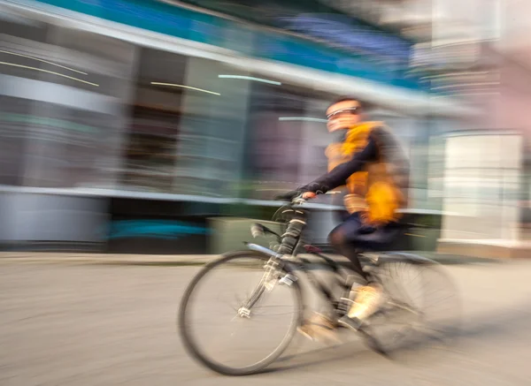 Cyclist in traffic on the city roadway — Stock Photo, Image