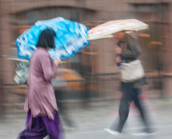 People walking down the street in rainy day — Stock Photo, Image