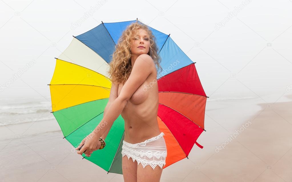naked girl with a colorful umbrella