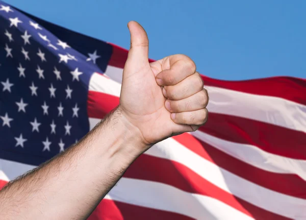 Tumb up sign against of USA flag — Stock Photo, Image