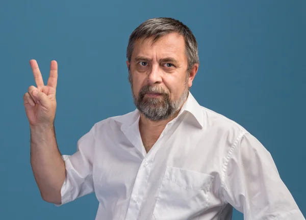 Man in  showing victory sign — Stock Photo, Image