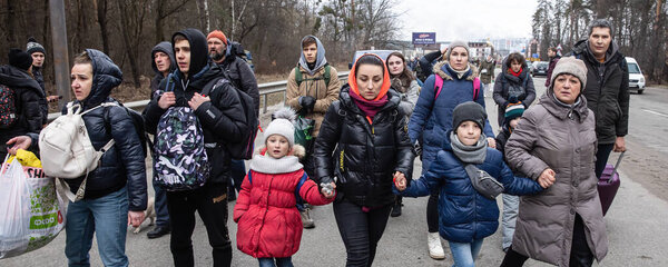 KYIV, UKRAINE - Mar. 05, 2022: War of Russia against Ukraine. Women, old people and children evacuated from Irpen town was transferd to Kyiv by Kyiv territorial defense battalion. War refugees in Ukraine