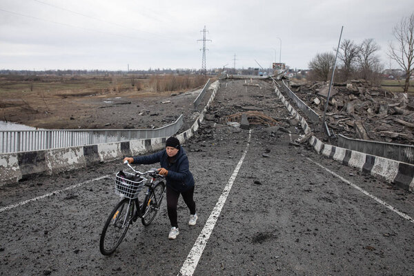 BORODYANKA, UKRAINE - APR. 06, 2022: War in Ukraine. Blown up bridge at the entrance to Borodianka as a result of the attack of Russian invaders