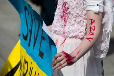 KYIV, UKRAINE - May 23, 2022: Wifes, mothers, kids of Ukrainian soldiers and members of Azov Battalion attend a rally to help organize a humanitarian corridor for the evacuation from Mariupol