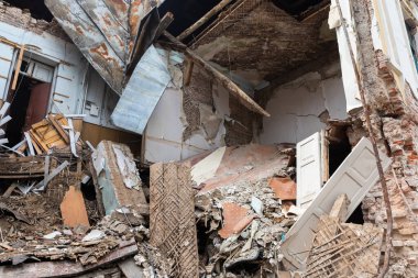 KHARKIV, UKRAINE - Aug. 01, 2022: Destroyed building in historical downtown as a consequences of Russian shelling in Kharkiv. War of Russia against Ukraine