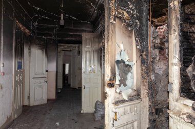 KHARKIV, UKRAINE - Aug. 01, 2022: Burnt and damaged city hospital in the historical building in Kharkiv. Destroyed building in historical downtown as a consequences of Russian shelling in Kharkiv