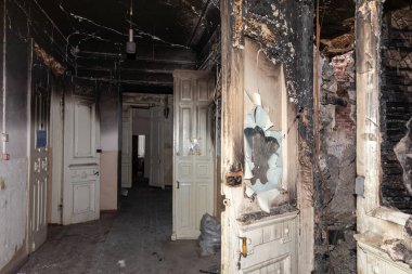KHARKIV, UKRAINE - Aug. 01, 2022: Burnt and damaged city hospital in the historical building in Kharkiv. Destroyed building in historical downtown as a consequences of Russian shelling in Kharkiv clipart
