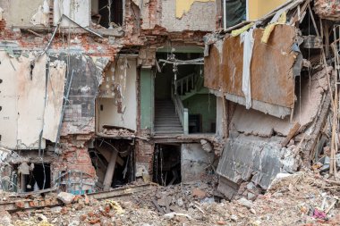 KHARKIV, UKRAINE - Jul. 28, 2022: A completely destroyed residential apartment building is visible on the streets of Kharkiv. Destroyed and damaged houses as a result of shelling by Russian invaders