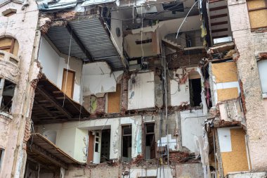 KHARKIV, UKRAINE - Jul. 28, 2022: A completely destroyed residential apartment building is visible on the streets of Kharkiv. Destroyed and damaged houses as a result of shelling by Russian invaders