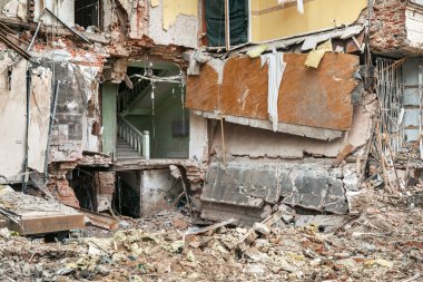 KHARKIV, UKRAINE - Jul. 28, 2022: A completely destroyed residential apartment building is visible on the streets of Kharkiv. Destroyed and damaged houses as a result of shelling by Russian invaders