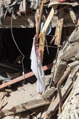 CHUHUIV, UKRAINE - Jul. 29, 2022: Traditional Ukrainian shirt is seen in the middle of destroyed by rocket the cultural center in Chuhuiv, Kharkiv region, Ukraine