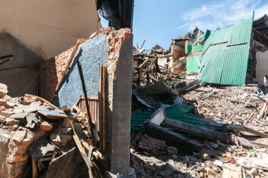 CHUHUIV, UKRAINE - Jul. 29, 2022: Brick ruined wall of destroyed by rocket the cultural center in Chuhuiv, Kharkiv region, Ukraine