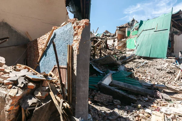 CHUHUIV, UKRAINE - Jul. 29, 2022: Brick ruined wall of destroyed by rocket the cultural center in Chuhuiv, Kharkiv region, Ukraine